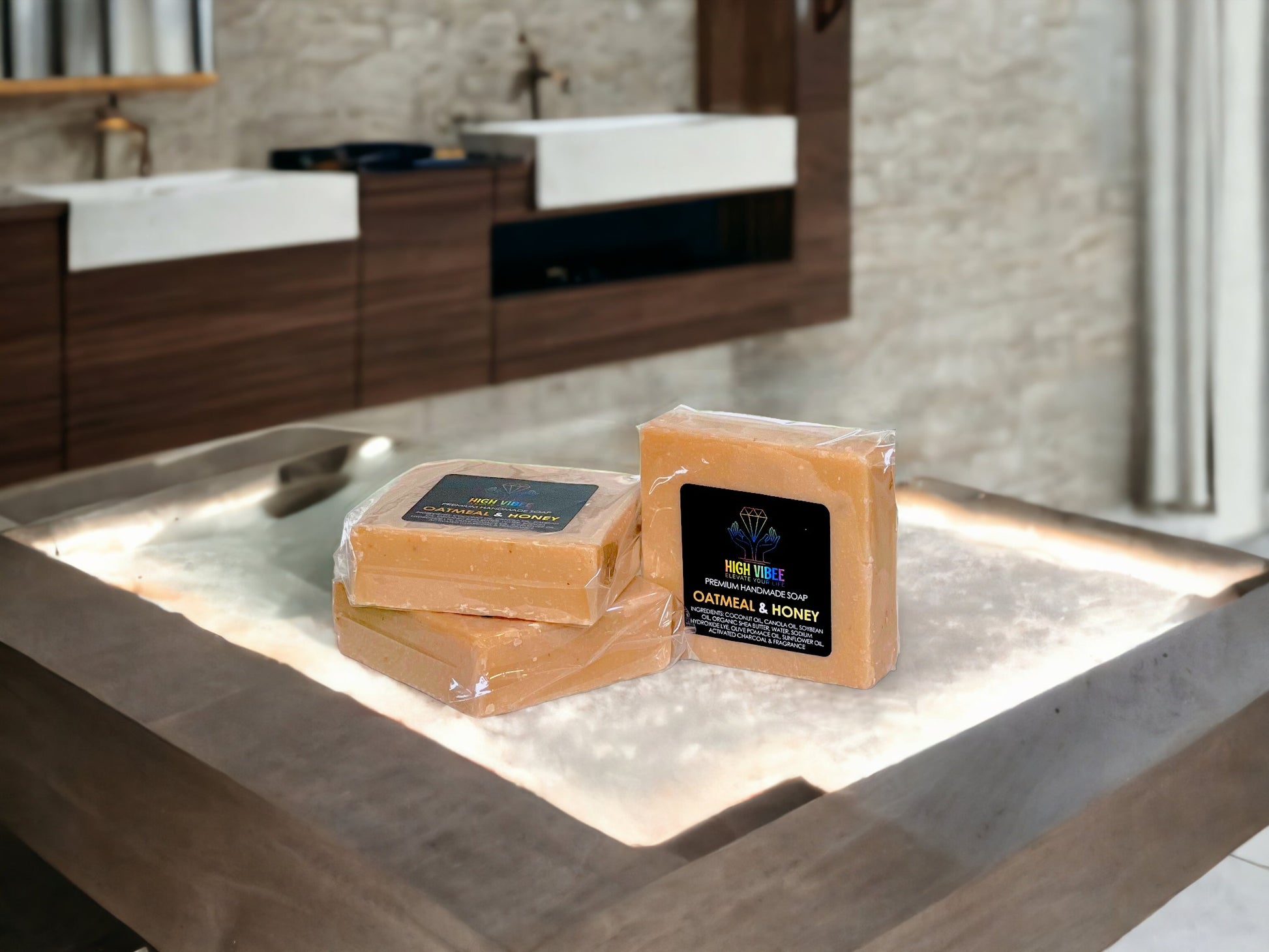 In the photo, there is the “Oatmeal & Honey” High Vibee Soap. The soap is a tan color. The photo shows three of these soaps on top of a cloth on a beautiful bathroom counter.