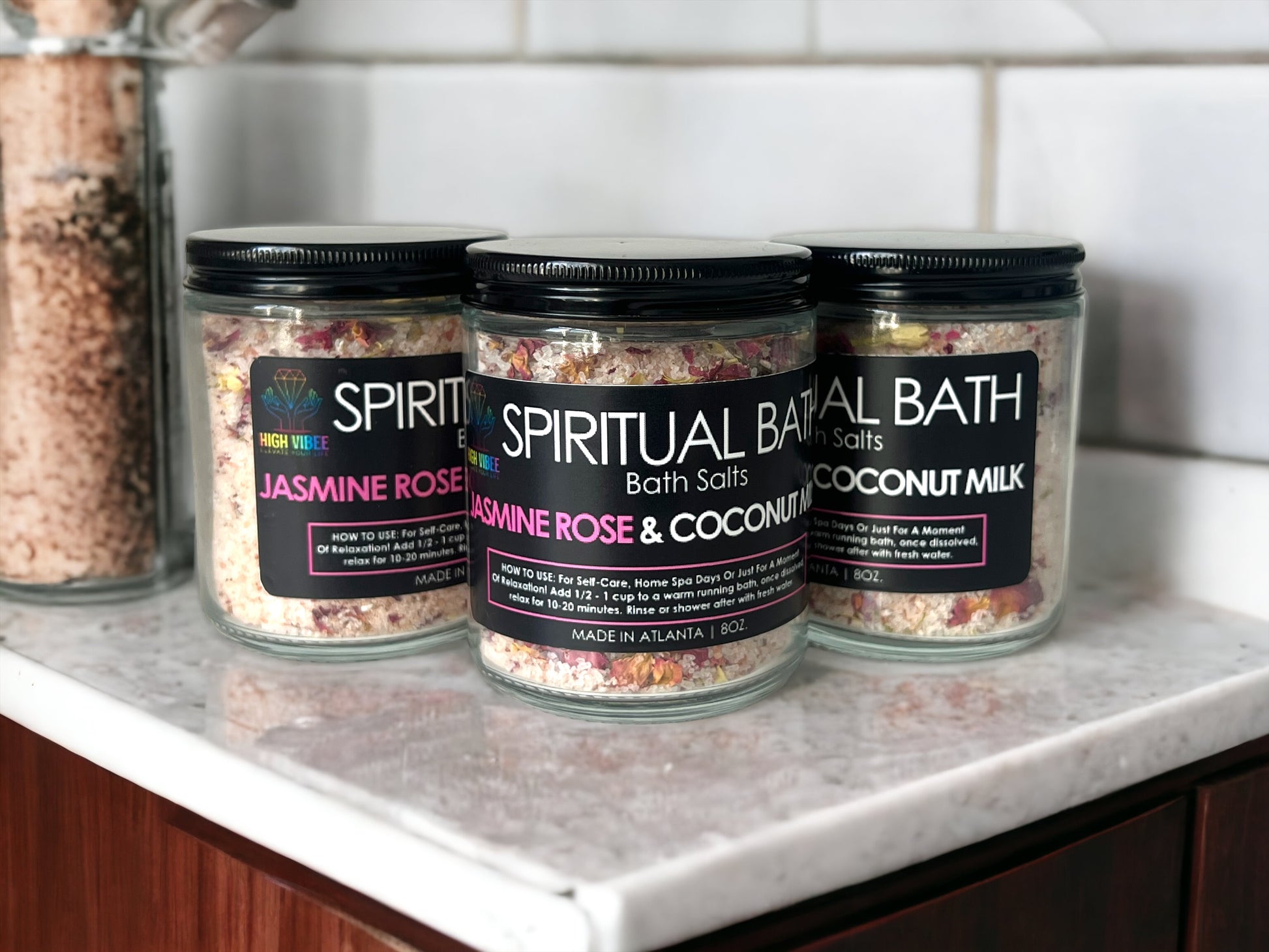 In this photo, High Vibee's "Jasmine Rose & Coconut Milk" Spiritual Bath Salt is shown.