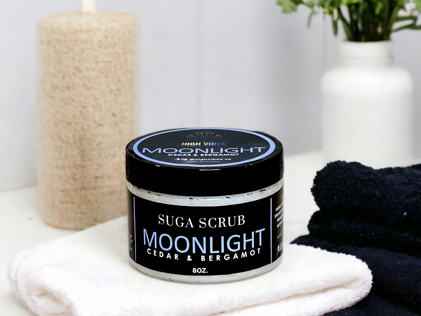 In this photo, there Is a jar of “Moonlight” Sugar Scrub, scented with Cedar & Bergamot.