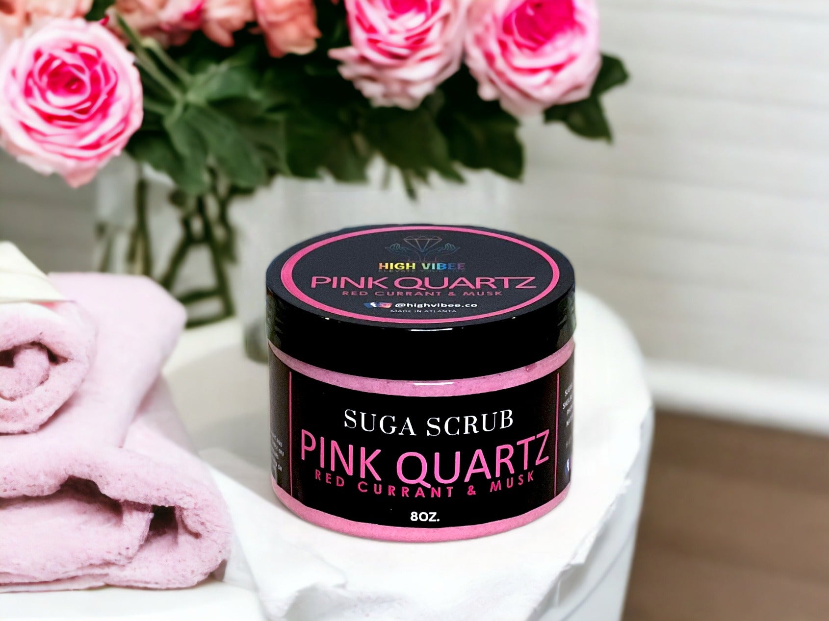 In this photo, there Is a jar of “Pink Quartz” Sugar Scrub, scented with Red Currant & Musk.