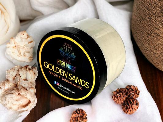 In this photo, there is a jar of High Vibee's “Golden Sands” Body Butta scented with Peach & Sandalwood.