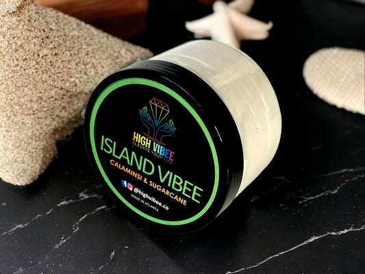In this photo, there is a jar of High Vibee's “Island Vibee” Body Butta scented with Calamansi & Sugarcane.
