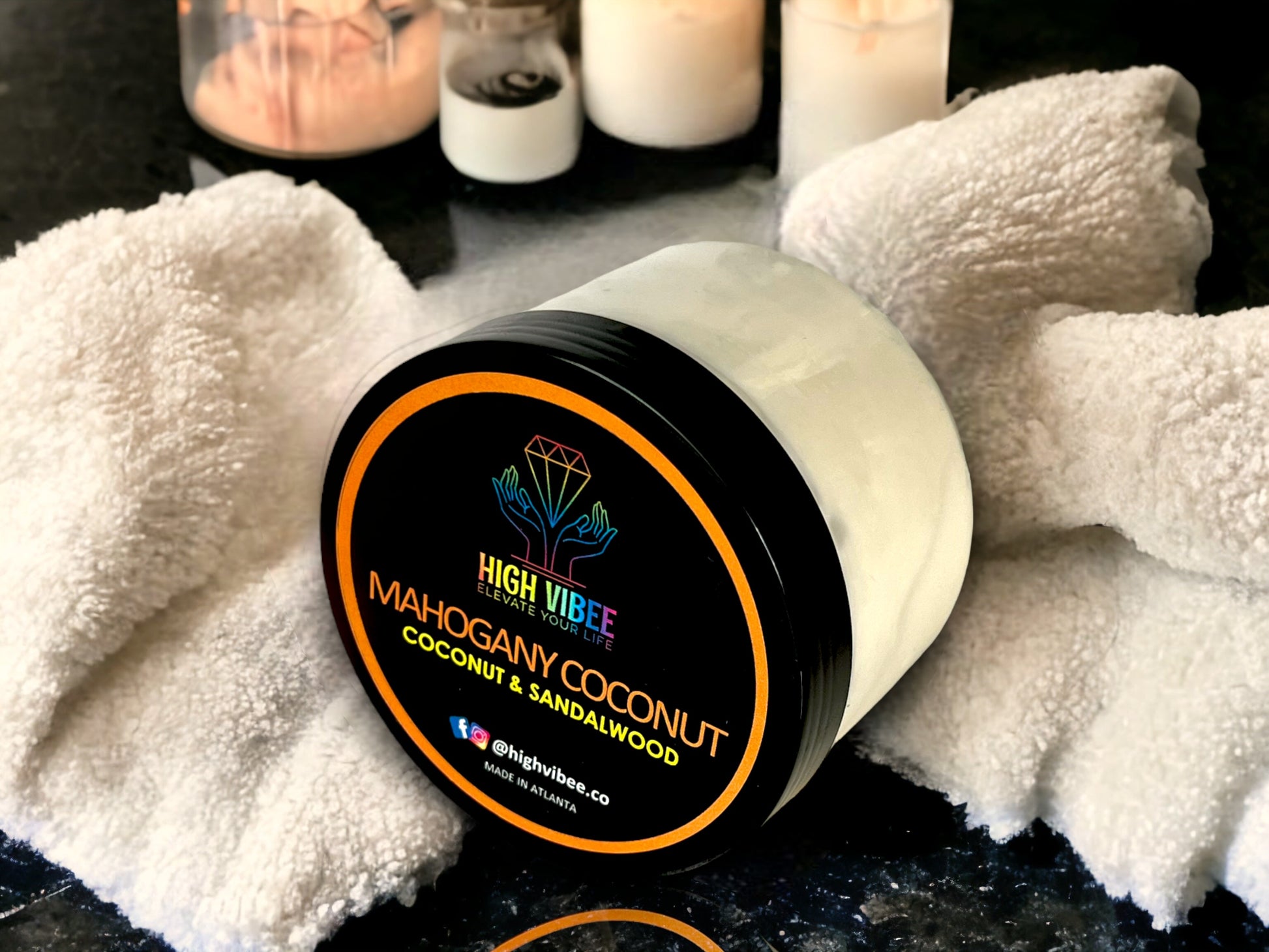 In this photo, there is a jar of High Vibee's “Mahogany Coconut” Body Butta scented with Coconut & Sandalwood.